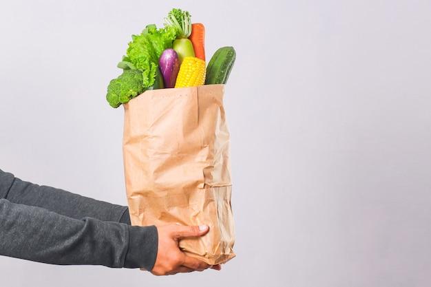 How much weight can a paper and plastic grocery bag hold? 