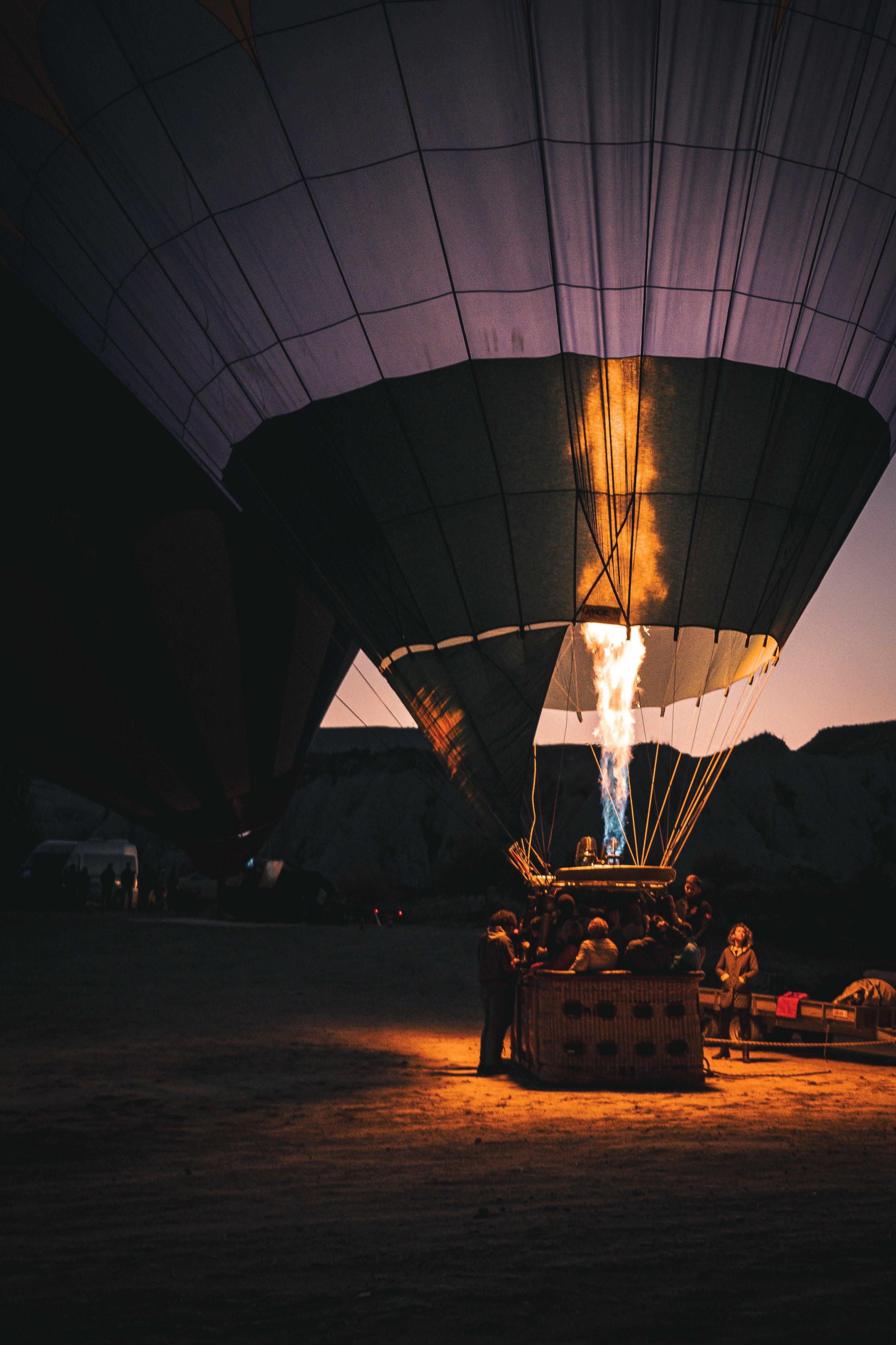 What happens to the air inside the balloon when heated? 
