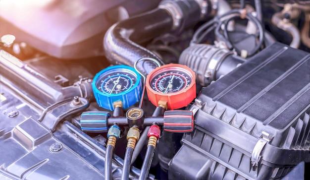 Where is the AC compressor located in a car? 