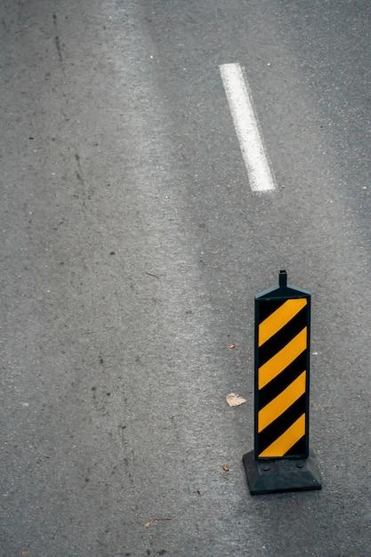 What do diagonal yellow stripes on the road mean? 