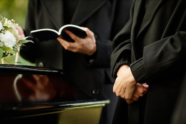 What do you say after reading scripture at a funeral? 