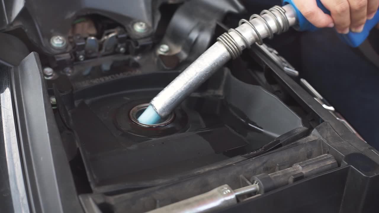 Where is the fuel filter located on a Ford Escape? 